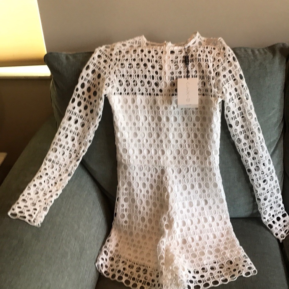 Alexis white jump suit, tags still on